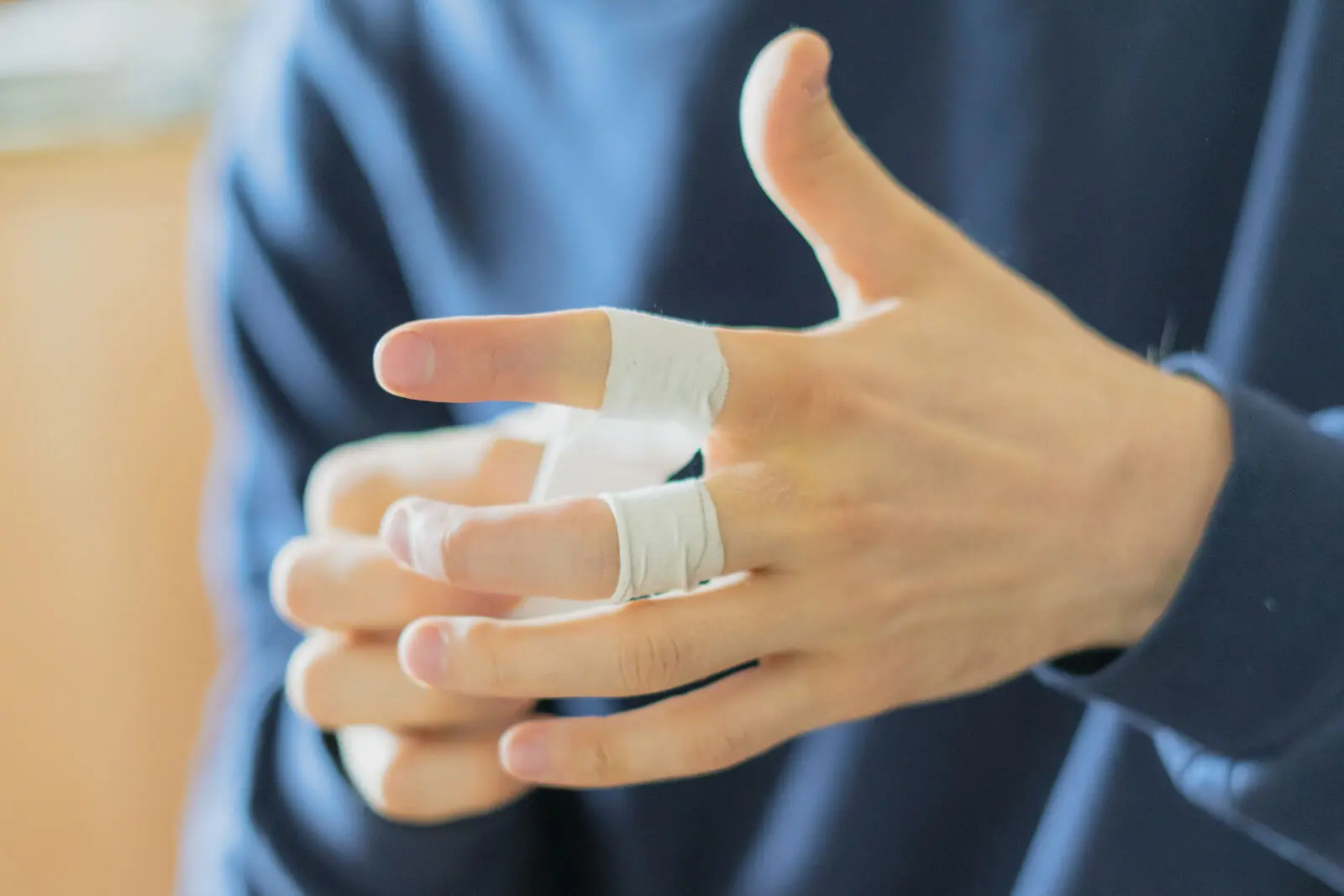 Hand therapist checking finger movement and splinting